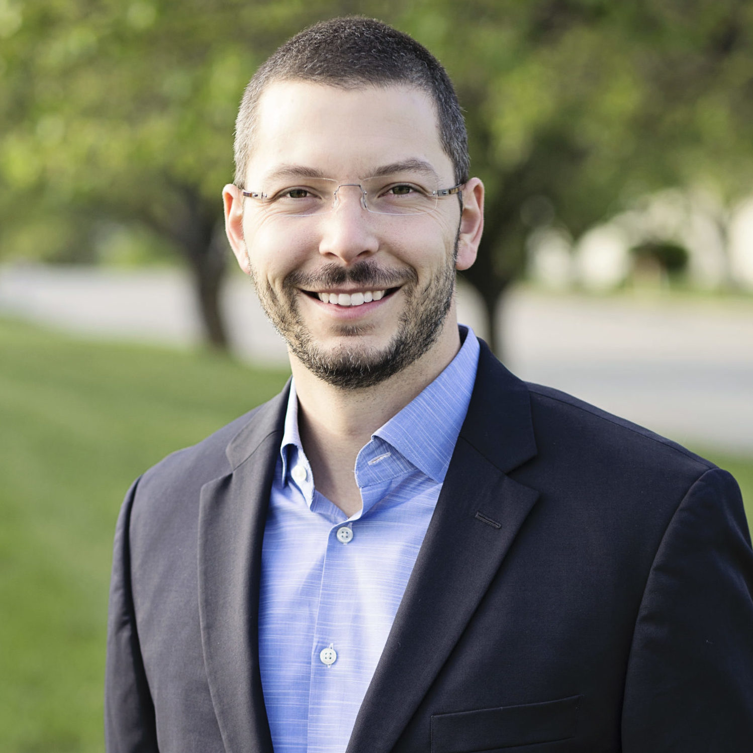 Adam Hill President and Chief Operating Officer headshot.